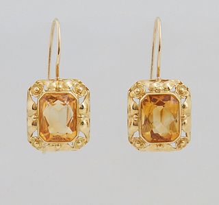 Pair of 18K Yellow Gold Pierced Earrings, each loop with a 4.2 ct. octagonal citrine, on a conforming pierced beaded border, total citrine wt.- 8.4 ct