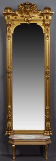 Empire Style Gilt and Gesso Pier Mirror, 19th c., perhaps by L. Uter, New Orleans, the arched outward crest with a relief Athena head, flanked by outw
