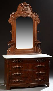 American Victorian Carved Mahogany Marble Top Dresser, c. 1880, the arched shell carved crest over a central high relief fruit and nut medallion, abov