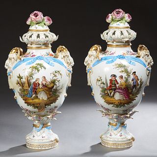 Pair of Continental Polychromed White Porcelain Covered Urns, 19th c., of baluster form, the pierced lids with floral handles, the sides with large gi