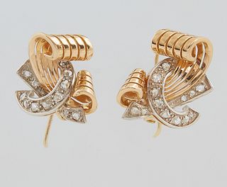 Pair of 18K Yellow Gold Art Deco Style Pierced Earrings, the swirled gold scroll bisected by a round diamond mounted "C" shape ribbon, H.- 3/4 in., W.