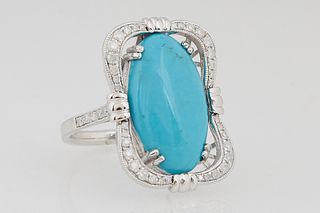 Lady's 14K White Gold Dinner Ring, with an oval 5.6 ct. cabochon turquoise within an undulating pierced diamond mounted border, the shoulders of the b