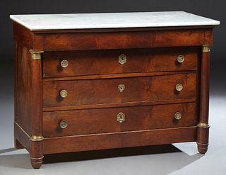 French Empire Style Carved Cherry Ormolu Mounted Marble Top Commode, 19th c., the figured white marble over a frieze drawer and three setback large dr
