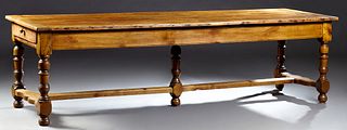 Exceptional French Carved Cherry Farmhouse Table, 19th c., the rectangular top over a wide skirt with one end drawer, on turned tapered block trestle 