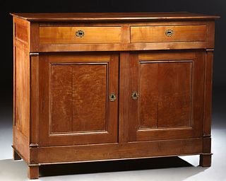 French Provincial Louis Philippe Carved Cherry Sideboard, 19th c., the rectangular top over two frieze drawers and double cupboard doors, on a plinth 
