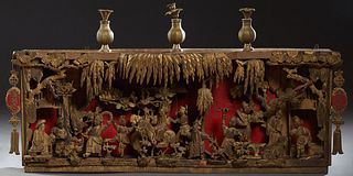 Chinese Carved Giltwood Architectural Frieze/Diorama, Qing Dynasty (1644-1911), depicting figures in a procession with relief elements against a red g
