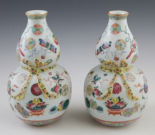 Pair of Chinese Famille Rose Porcelain Double Gourd Vases, 19th c., with floral, cloud and vase decoration, the waisted center with a relief yellow ri
