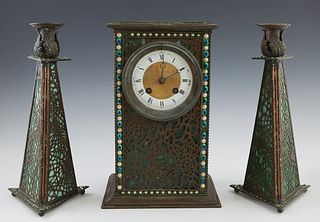 Three Pieces of Tiffany Style Copper Clock Garniture, late 19th c., consisting of a clock having a reticulated grapevine pattern design with green sla