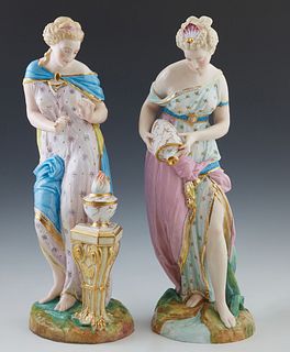 Pair of Meissen Style Porcelain Figures, 20th c., of classically draped women, one warming over a fire; the second pouring from a jug, H.- 16 3/4 in.,
