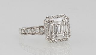 Lady's 14K White Gold Dinner Ring, the top mounted with a vertical row of baguette diamonds, flanked by a round diamond on each corner, atop an octago