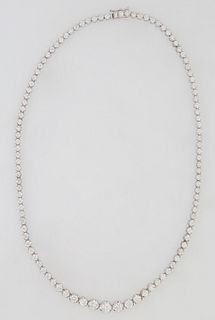 14K White Gold Tennis Necklace, each of the 106 links with a graduated round diamond, total diamond wt.- 9.97 cts., L.- 16 1/2 in., with appraisal.