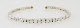 14K White Gold Bangle Bracelet, the top mounted with 31 round graduated diamonds, total diamond wt.- 2.3 cts., Int. W.- 2 in., Int. D.- 1 5/8 in., wit