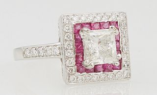 Lady's Platinum Dinner Ring, with a central 1.3 carat princess cut diamond atop a border of round rubies and an outer border of round diamonds, the sh