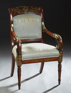 Empire Style Parcel Gilt and Paint Decorated Carved Mahogany Fauteuil, 20th c., the curved canted upholstered back over gilt and paint decorated scrol