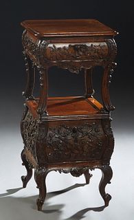 Louis XV Style Bombe Night Stand, late 19th c., with a single frieze drawer with relief carving, over a drop front pot cupboard carved with relief mus