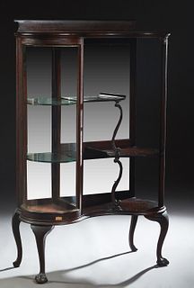 American Carved Mahogany Curved Glass Curio Parlor Cabinet/Etagere, early 20th c., the splash back over a curved glass single door cabinet proper righ