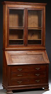 French Provincial Louis Philippe Carved Inlaid Walnut Secretary Bookcase, the stepped rounded corner crown over double glazed doors, above a slant fro