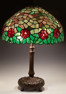 Handel Style Leaded Glass Table Lamp, late 20th c., the domed floral slag glass shade with red cabochon "jewels," on an octagonal patinated spelter re