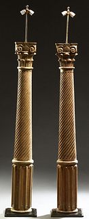Pair of Carved Gilt Wood Columns, 20th c., now made into floor lamps, possibly by Ralph Lauren, with carved capitols on tapered swirl carved supports,