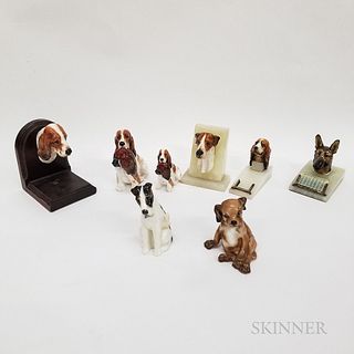 Eight Royal Doulton Ceramic Dog Items