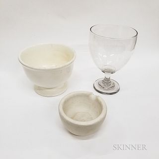 Blown Colorless Glass Compote, a White Footed Bowl, and a Stone Mortar