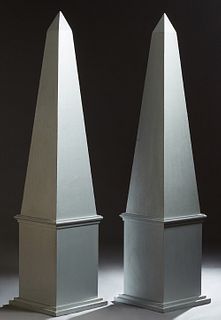 Pair of Monumental Carved Pine Obelisks, 20th c., on integral stepped bases, now in silver paint, H.- 86 in., W.- 20 in., D.- 20 in.