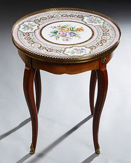 French Ormolu Mounted Louis XV Style Carved Mahogany Porcelain Top Lamp Table, 20th c., the brass galleried porcelain plate with a hand painted floral