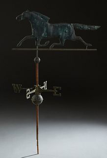 Metal Horse Weathervane, 20th c., on an iron support, atop a directional marker, H.- 57 in., W.- 32 in., D.- 19 in. Provenance: from a collection of a