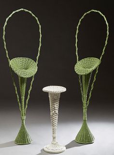 Three Woven Wicker Flower Baskets, early 20th c., consisting of a pair in green paint with tall handles, and a smaller white example, Green- H.- 67 in