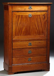 French Louis Philippe Style Carved Mahogany Secretary Abattant, 19th c., the rounded edge and corner top over a setback frieze drawer and a fall front