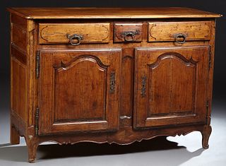 French Louis XV Style Carved Walnut Sideboard, c. 1820, the rounded edge and corner plank top above three frieze drawers over arched fielded panel cup