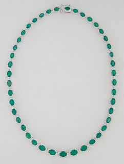 18K White Gold Link Necklace, each of the 43 oval links with a graduated oval emerald atop a border of small round diamonds, total emerald weight- 29.