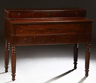 French Louis Philippe Style Carved Mahogany Desk, 19th c., with a bank of three drawers over a pullout fall front desk with a curly maple interior wit