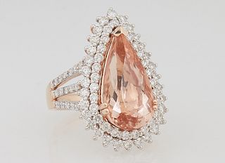 Lady's 14K Rose Gold Dinner Ring, with a pear shaped 6.61 carat morganite atop a double concentric graduated border of small round diamonds, the tripl