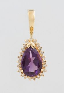 14K Yellow Gold Pendant, with a 5 carat pear shaped amethyst, atop a conforming border of tiny round diamonds, with a hinged opening bail, H.- 5/8 in.