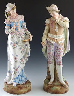 Large Pair of Meissen Style Polychromed Porcelain Figures, early 20th c., of a man and a woman in 18th c. costume, on integral circular bases, H.- 23 
