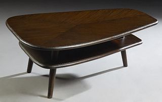 Mid-Century Modern Style Carved Mahogany Coffee Table, 20th c., of trapezoidal form, the stepped top over a like shaped middle shelf, on cylindrical l