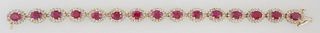 14K Yellow Gold Link Bracelet, each of the 15 oval links with an oval ruby atop a border of round diamonds, total ruby wt.- 12.88 cts., total diamond 