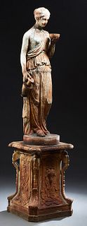 Cast Iron Garden Figure of a Classically Draped Woman, 19th c., holding a bowl and a jug, on an integral circular iron plinth, atop a cast iron stand 