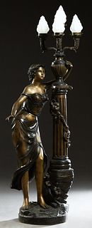 Patinated Bronze Figural Floor Lamp, 21st c., the classically draped woman upholding an urn mounted with four lights with glass flammiform shades, ato