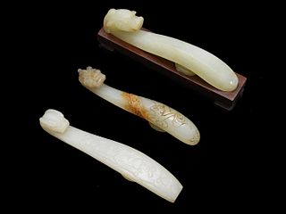 Three Chinese White Jade Dragon Hooks, Ming