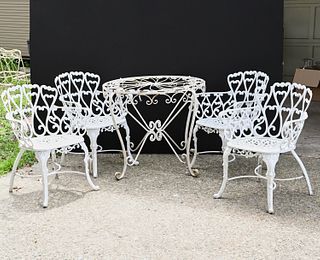 Assembled set painted iron patio table and chairs