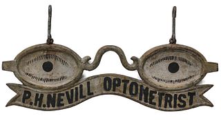 AN EARLY 20TH CENTURY HANGING OPTOMETRIST'S TRADE SIGN