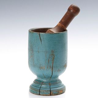 AN EARLY 19TH C. WOOD MORTAR WITH PESTLE AND BLUE PAINT