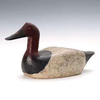 AN EARLY 20THC CARVED AND PAINTED CANVASBACK DUCK DECOY
