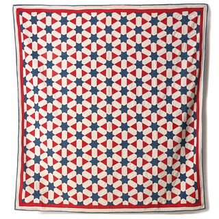 A RED, WHITE AND BLUE HEXAGON STARS AND LATTICE QUILT
