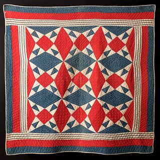A 19TH C. RED, WHITE AND BLUE 'IOWA STAR' CRIB QUILT