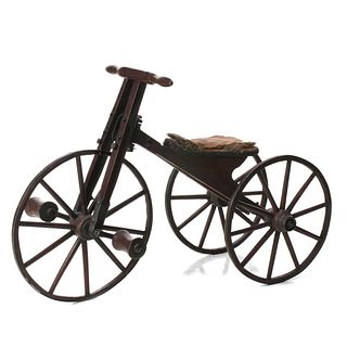A 19TH C. BONE SHAKER TRICYCLE IN ORIGINAL RED PAINT