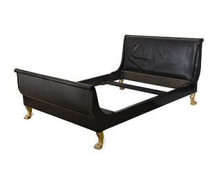 An Empire Style Ebonized and Gilt Wood Sleigh Bed
Height 43 x width 66 x depth 96 inches.