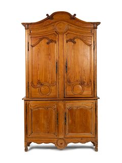 A Louis XV Provincial Style Carved Fruitwood Buffet a Deux Corps
Height 95 x width 66 x depth 29 inches.